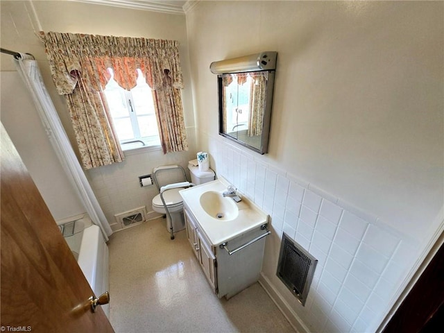 3015 S NC Highway 87, Graham, NC 27253 - bathroom featuring tile walls, toilet, vanity, wainscoting, and crown molding