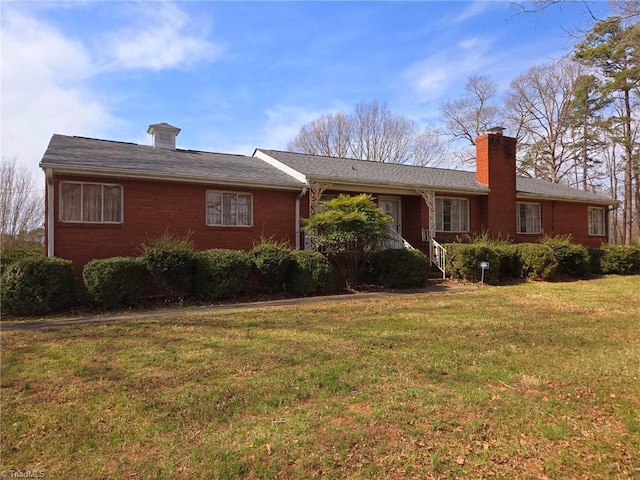 3015 S NC Highway 87, Graham, NC 27253 - ranch-style house featuring a chimney, a front yard, and brick siding