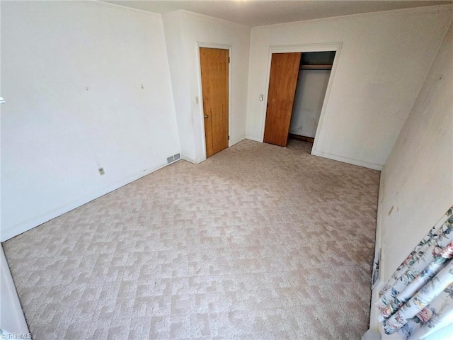 3015 S NC Highway 87, Graham, NC 27253 - unfurnished bedroom with ornamental molding, carpet floors, a closet, and baseboards