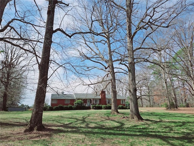 3015 S NC Highway 87, Graham, NC 27253 - ranch-style home with a front yard and a chimney