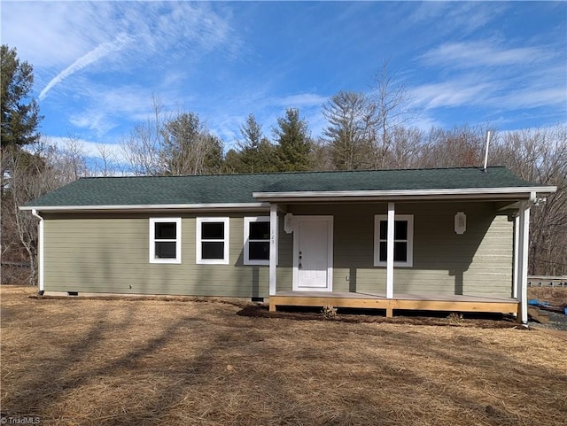 view of front of home featuring roof with shingles