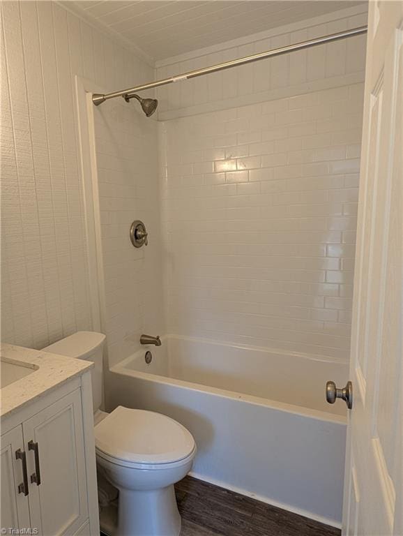 full bath featuring toilet, shower / bath combination, vanity, and wood finished floors