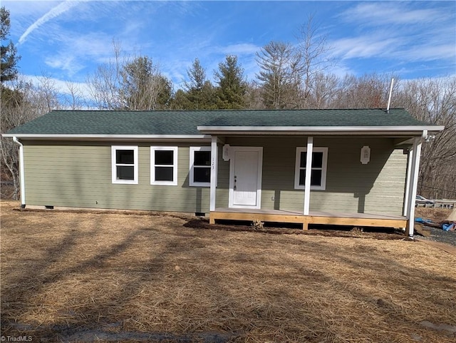view of front of property with roof with shingles