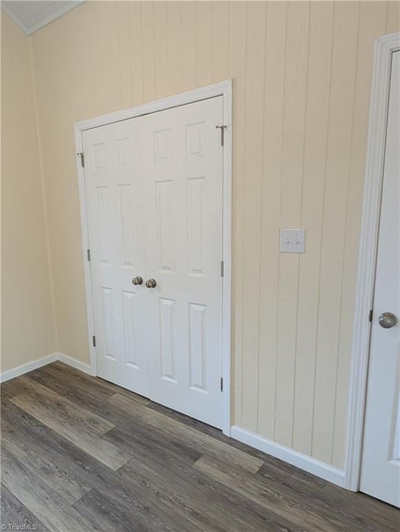 room details with baseboards, crown molding, and wood finished floors
