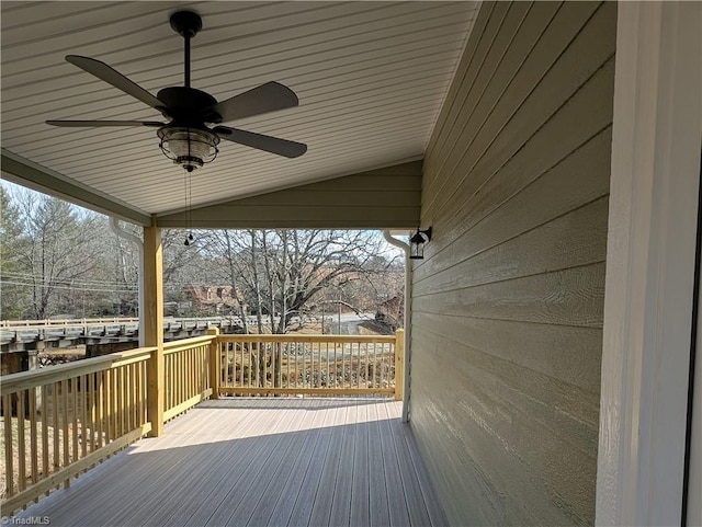 wooden deck featuring a ceiling fan