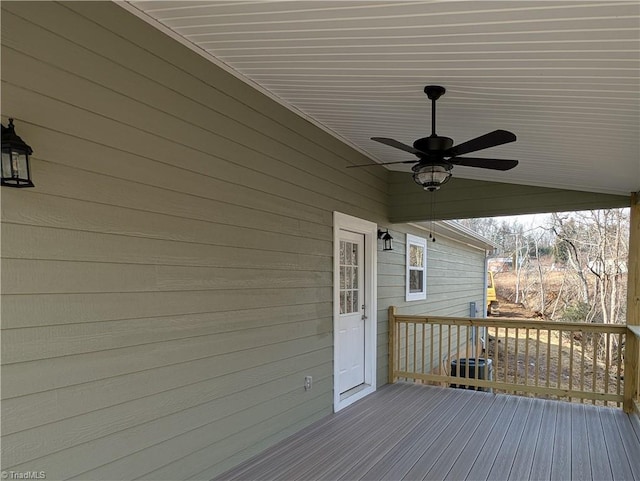 wooden deck with a ceiling fan