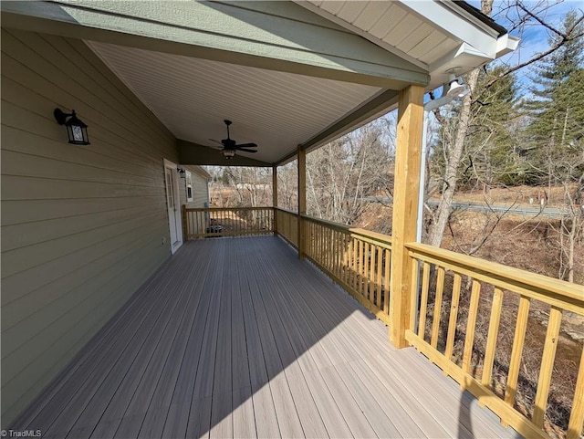 wooden deck featuring ceiling fan