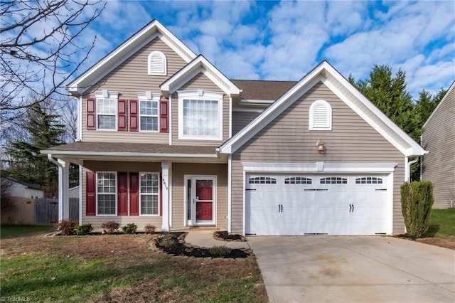 view of front of house featuring a front lawn and a garage