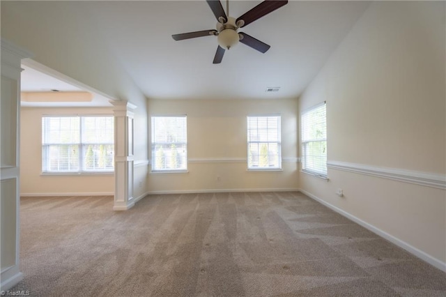 empty room featuring ceiling fan, lofted ceiling, and light carpet