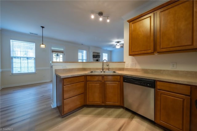 kitchen with sink, light hardwood / wood-style flooring, stainless steel dishwasher, ceiling fan, and kitchen peninsula