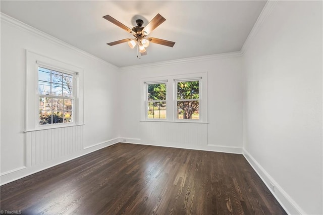 spare room with ceiling fan, dark hardwood / wood-style flooring, and crown molding