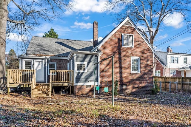 rear view of property featuring a deck