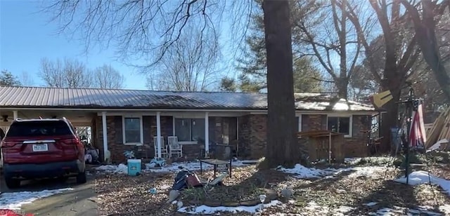 single story home with a carport