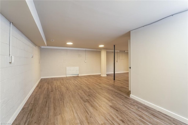 5170 Sunrise Ter, Winston-Salem, NC 27105 - finished below grade area with wood finished floors, baseboards, concrete block wall, and recessed lighting