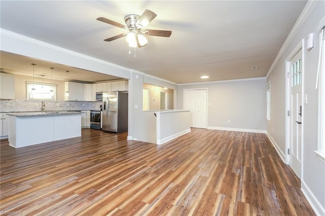5170 Sunrise Ter, Winston-Salem, NC 27105 - unfurnished living room featuring dark wood-type flooring, baseboards, crown molding, and ceiling fan