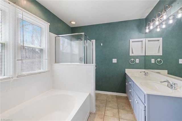 full bath with a bath, a stall shower, a sink, and tile patterned floors