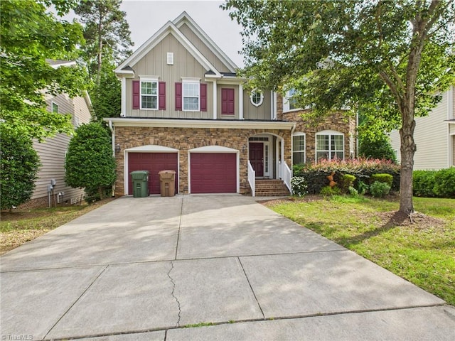 1728 Callandale Ave, Cary, NC 27518 - view of front of house featuring stone siding, board and batten siding, driveway, and an attached garage