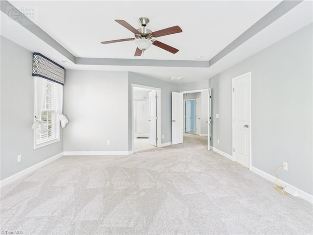 1728 Callandale Ave, Cary, NC 27518 - unfurnished bedroom with a raised ceiling, light colored carpet, and baseboards