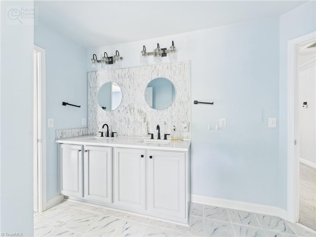 1728 Callandale Ave, Cary, NC 27518 - bathroom with double vanity, marble look tiles, decorative backsplash, and baseboards