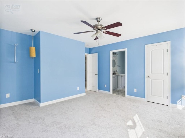 1728 Callandale Ave, Cary, NC 27518 - unfurnished bedroom featuring carpet, baseboards, connected bathroom, and a ceiling fan