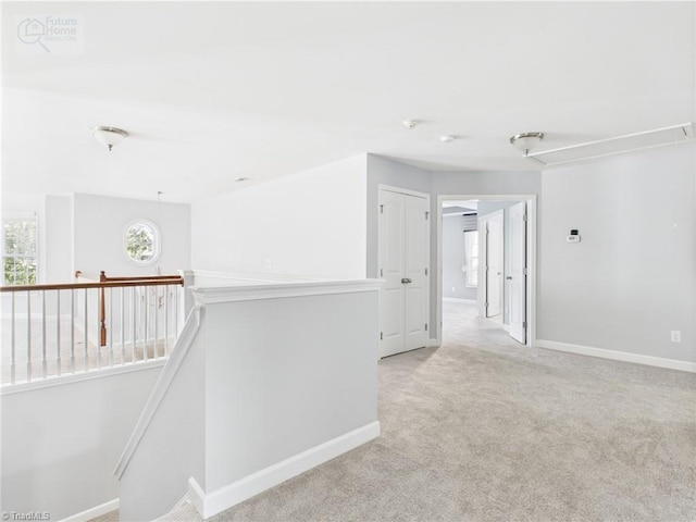 1728 Callandale Ave, Cary, NC 27518 - corridor with an upstairs landing, attic access, baseboards, and light carpet
