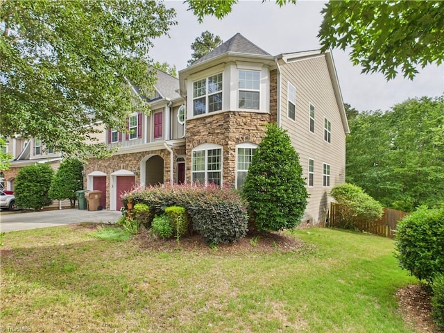1728 Callandale Ave, Cary, NC 27518 - view of front of home featuring stone siding, concrete driveway, and an attached garage