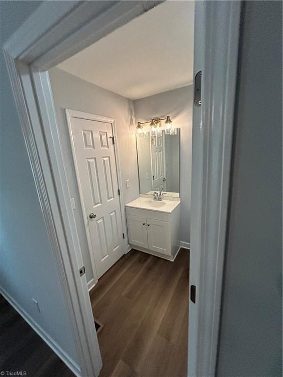 bathroom featuring vanity and hardwood / wood-style floors