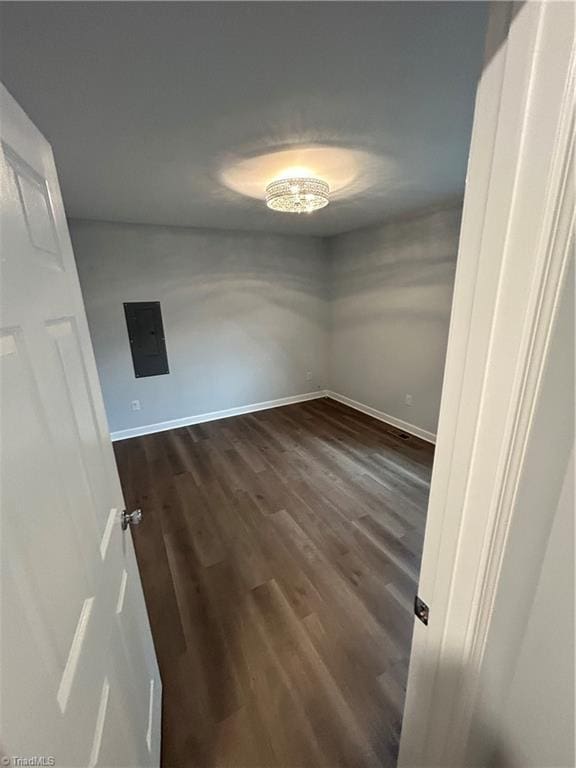 spare room featuring dark hardwood / wood-style flooring