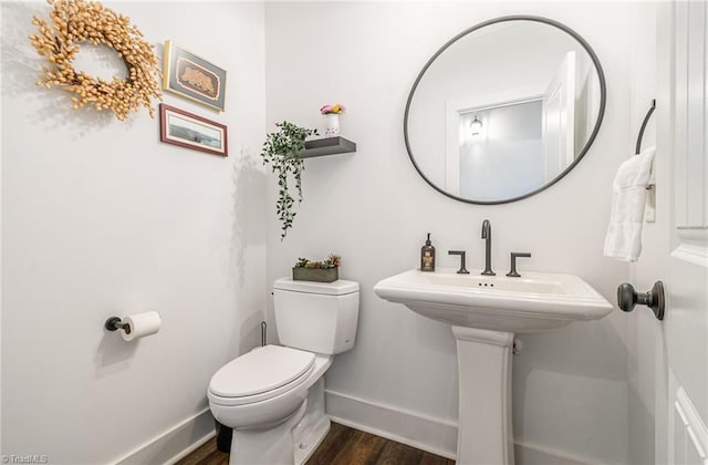 602 Shoreline Rd, New London, NC 28127 - half bath featuring baseboards, wood finished floors, and toilet