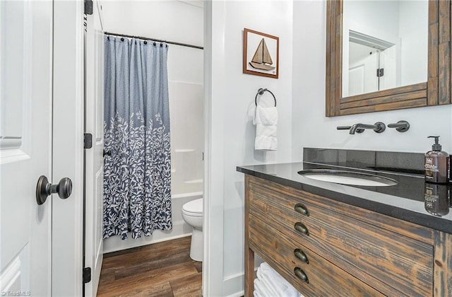 602 Shoreline Rd, New London, NC 28127 - bathroom with wood finished floors, vanity, toilet, and shower / tub combo