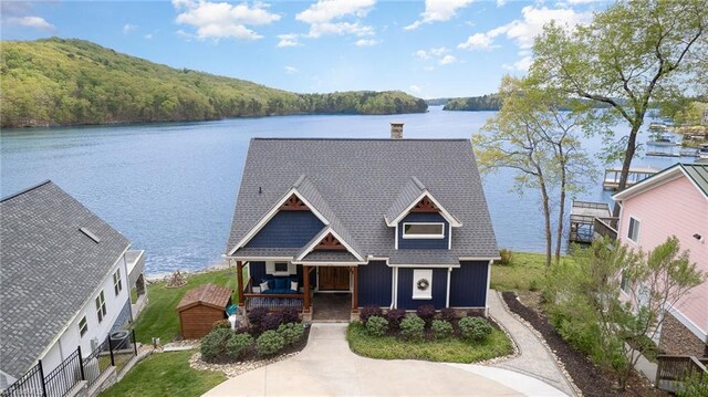 602 Shoreline Rd, New London, NC 28127 - view of front of property with a water view, central AC, a porch, a chimney, and a view of trees