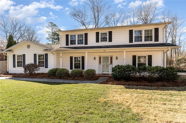 view of front of property featuring a front lawn and a porch