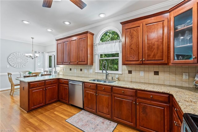 396 Bent Creek Trl, Kernersville, NC 27284 - kitchen with stainless steel appliances, a peninsula, light wood-style flooring, crown molding, and decorative backsplash