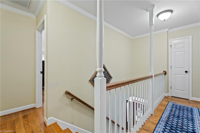 396 Bent Creek Trl, Kernersville, NC 27284 - corridor featuring an upstairs landing, wood finished floors, and ornamental molding
