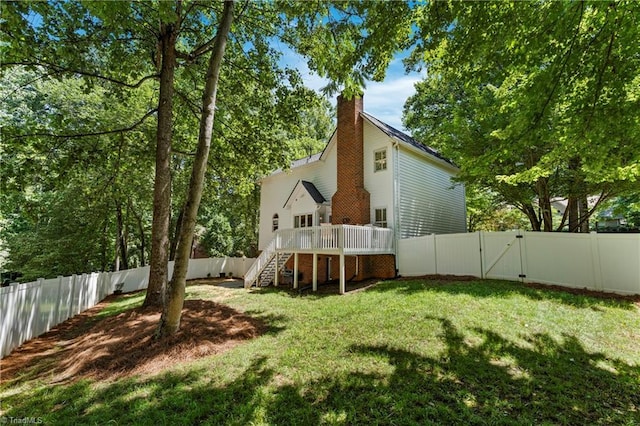 396 Bent Creek Trl, Kernersville, NC 27284 - back of property with stairs, a wooden deck, a fenced backyard, and a chimney