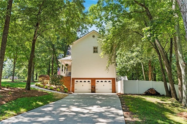 396 Bent Creek Trl, Kernersville, NC 27284 - view of side of home featuring brick siding, a garage, and concrete driveway