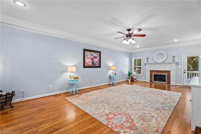 396 Bent Creek Trl, Kernersville, NC 27284 - living room featuring a fireplace, crown molding, a ceiling fan, wood finished floors, and recessed lighting