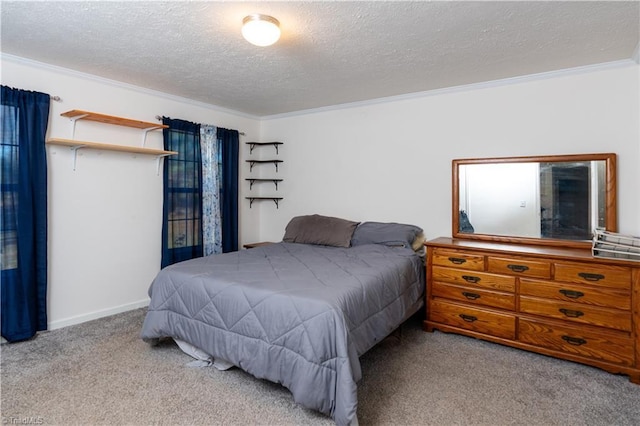 bedroom with a textured ceiling, ornamental molding, and light carpet