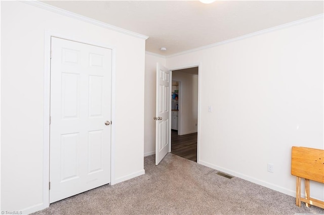 unfurnished bedroom with light carpet and ornamental molding