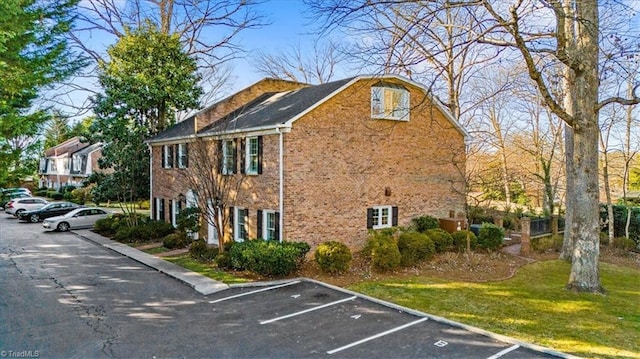 view of property exterior with a lawn