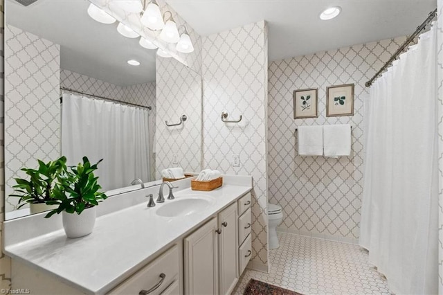 bathroom with vanity, toilet, and tile patterned flooring