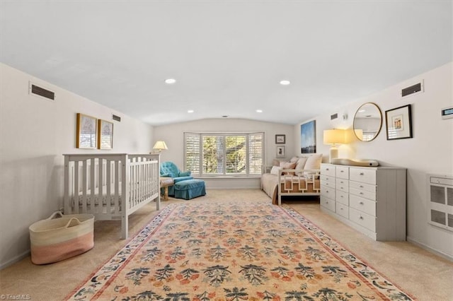 carpeted bedroom with lofted ceiling