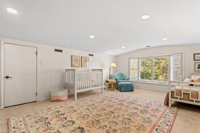 bedroom featuring vaulted ceiling and carpet floors