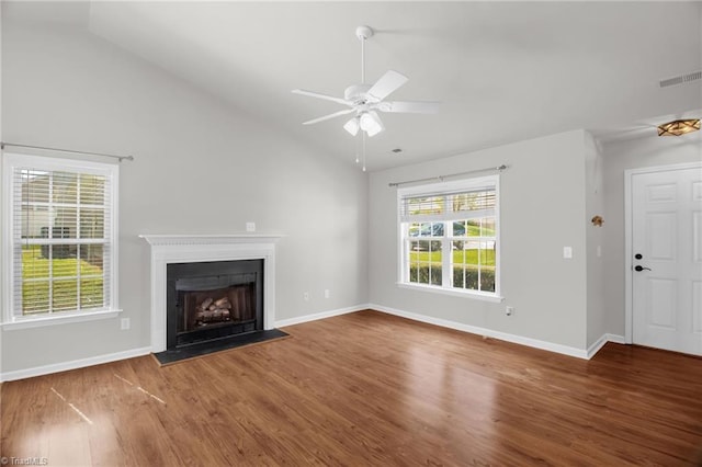 3931 Hickswood Forest Dr, High Point, NC 27265 - unfurnished living room with lofted ceiling, wood finished floors, a fireplace with flush hearth, ceiling fan, and baseboards