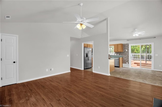 3931 Hickswood Forest Dr, High Point, NC 27265 - unfurnished living room with ceiling fan, wood finished floors, baseboards, and lofted ceiling