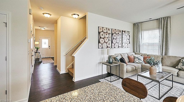 living room featuring dark hardwood / wood-style flooring