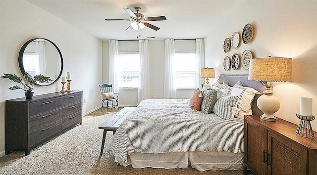 bedroom with light carpet and ceiling fan