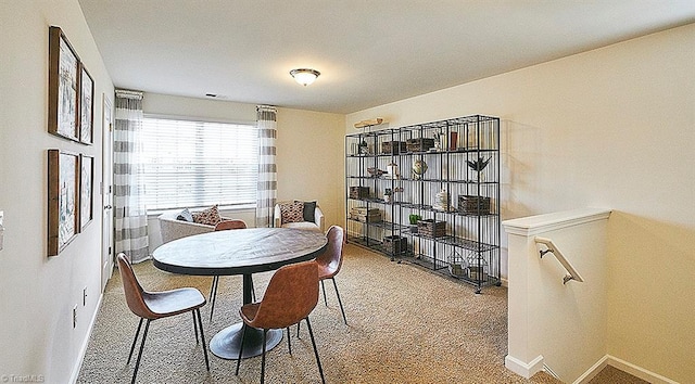 view of carpeted dining area