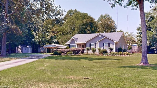 ranch-style house featuring a front lawn and a storage unit