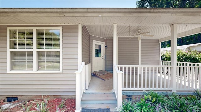 property entrance with ceiling fan and a porch